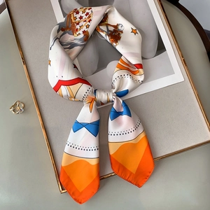 Equestrian pattern silk scarf with horse and star motif in elegant bow display