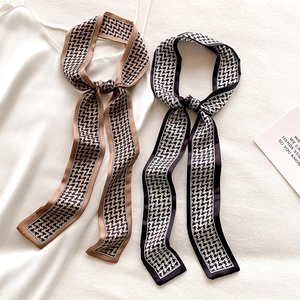 Houndstooth skinny silk scarf in brown and black on a white satin top for styling