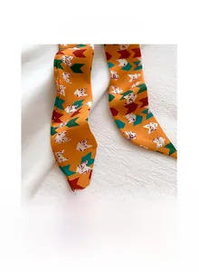 Detail of 5x200cm faux silk skinny scarf with geometric patterns and neat inner stitching