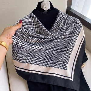 Classic houndstooth silk scarf for women featuring elegant black and white pattern