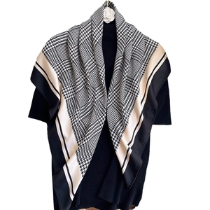 Elegant black and white houndstooth square scarf with beige border and flower brooch