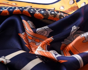 Detail of vintage horse carriage silk scarf showing twill texture and nautical print