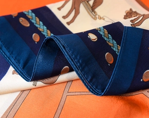Detail of vintage horse carriage silk scarf showing elegant prints and smooth texture
