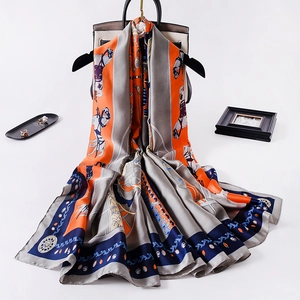 Vintage horse carriage silk scarf with equestrian print draped on a designer bag
