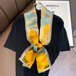 Detail of silk skinny scarf with yellow abstract oil painting print on black knitwear
