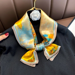 Close-up of artistic abstract oil painting print silk scarf tied on a black sweater