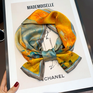 Close-up of silk skinny scarf with abstract oil painting print and striped border