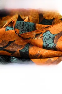 Detail shot of vintage floral silk scarf edge featuring premium stitching and 90x180cm size