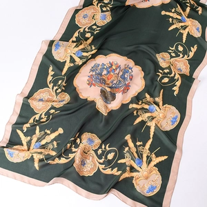 Detail of printed silk shawl featuring vintage floral patterns and smooth fabric texture
