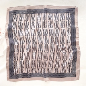 Pale pink tie-dye silk scarf featuring vertical geometric herringbone patterns with rolled edges