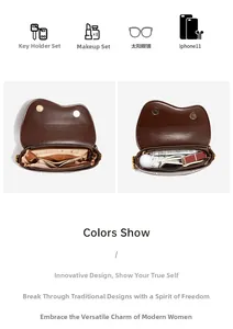 Detail view of the brown saddle bag interior showing compartments for phone and makeup