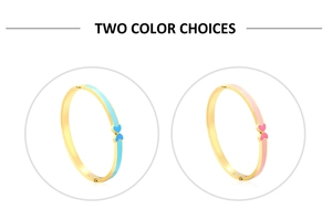Detail of gold-plated butterfly bangle with blue and pink enamel heart accents