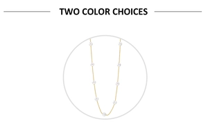 Detailed view of elegant round white pearls on a minimalist golden chain necklace