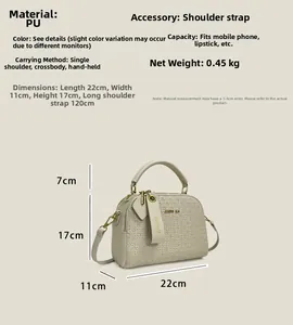 Detail view of the beige Boston bag showing dimensions 22x11x17cm and textured PU leather