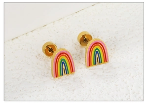 Macro shot of rainbow enamel stud earrings with gold base and secure screw back