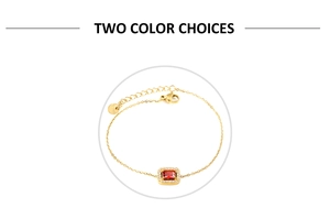 Vue macro d'un bracelet doré avec zircon rectangulaire rouge et halo de diamants