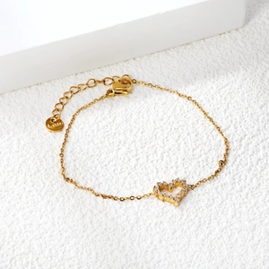 Elegant gold-plated stainless steel hollow heart bracelet with micro-pave white zircons