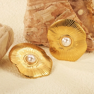 Vintage 18K gold earrings featuring a radiant sunburst design with a central white pearl