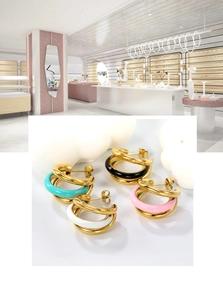 Detail of four pairs of 18K gold-plated C-shaped enamel earrings in varied colors