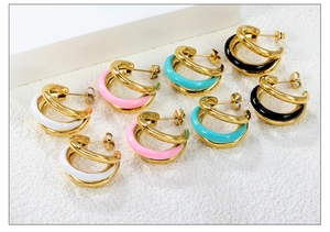 Detailed close-up of multi-layer C-shape gold earrings with colorful enamel oil drip accents