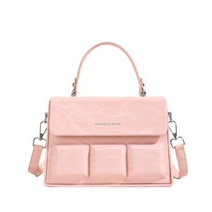 Pink box crossbody bag with textured leather and 3D square embossed details