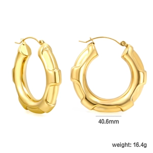 Detail of 40.6mm bamboo-style gold plated stainless steel U-shaped hoop earrings