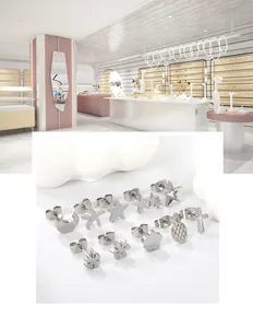 Macro view of 6-pair stainless steel stud earrings set with moon star and flower designs