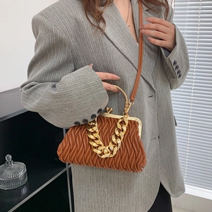 Caramel brown pleated shell bag with chunky gold chain handle and leather strap