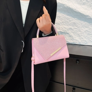 Chic pink glitter shoulder bag with gold hardware and top handle for women