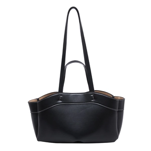 Minimalist black tote bag with white contrast stitching and dual handles for shoulder use