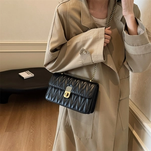 Chic black quilted crossbody bag with golden chain strap and vintage square lock for women