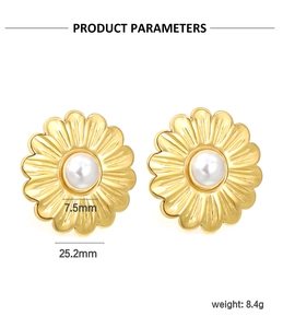 Detail view of 25.2mm gold flower earrings with 7.5mm white pearls and precise weights