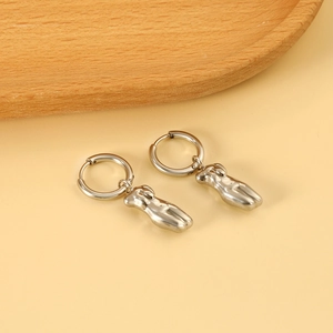 Polished silver stainless steel hoop earrings with abstract female torso charms