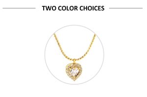 Detailed shot of golden necklace with heart zircon pendant and twisted chain link