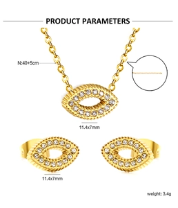Macro shot of gold-plated eye-shaped zircon necklace and earrings set with dimensions
