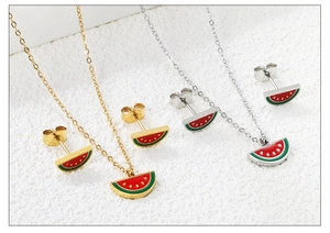 Detail of sweet watermelon necklace and stud earrings set in gold and silver finish