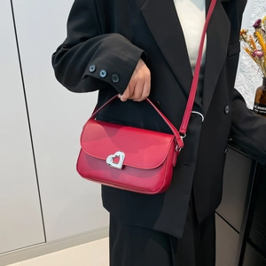 Red leather square handbag with silver heart-shaped clasp and detachable shoulder strap