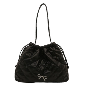Large quilted black tote bag with silver bow pendant and drawstring closure for women