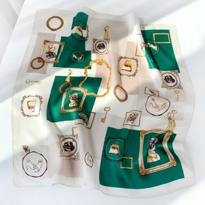 Detail of silk square scarf showing vintage portrait prints and elegant geometric patterns