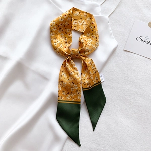 Floral skinny silk scarf in ginger yellow with white flowers and green contrast ends