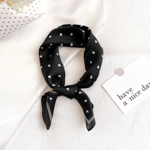 Elegant black silk square scarf featuring white sailboat prints and striped edge detail