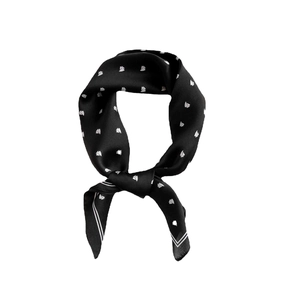 Black silk square scarf featuring white sailboat patterns and smooth polished texture