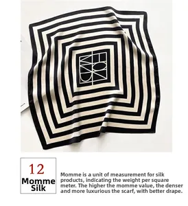 Detail view of 12 momme mulberry silk scarf with classic black and white striped pattern