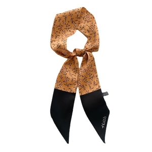 Floral print narrow silk scarf in ginger yellow and black with Hildi branding script