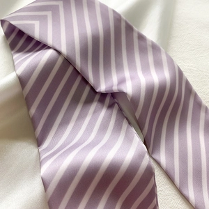 Macro detail of lavender striped silk scarf showing the elegant soft texture and sheen