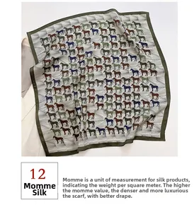 Detail of 12 momme silk square scarf featuring printed horse patterns and green borders