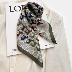 Elegant silk square scarf featuring vintage horse patterns on a white suit background