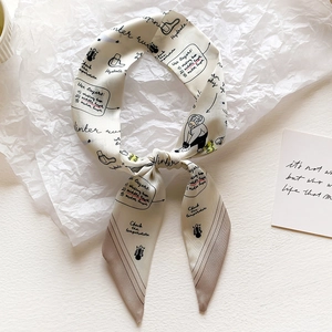 Detail of thin tie scarf with artistic winter run hand-drawn illustrations and pointed ends