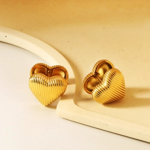 Golden heart-shaped hoop earrings with unique vertical textured stripes for women