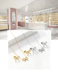 Détail du parure de bijoux nœud avec boucles d'oreilles et collier en or et argent